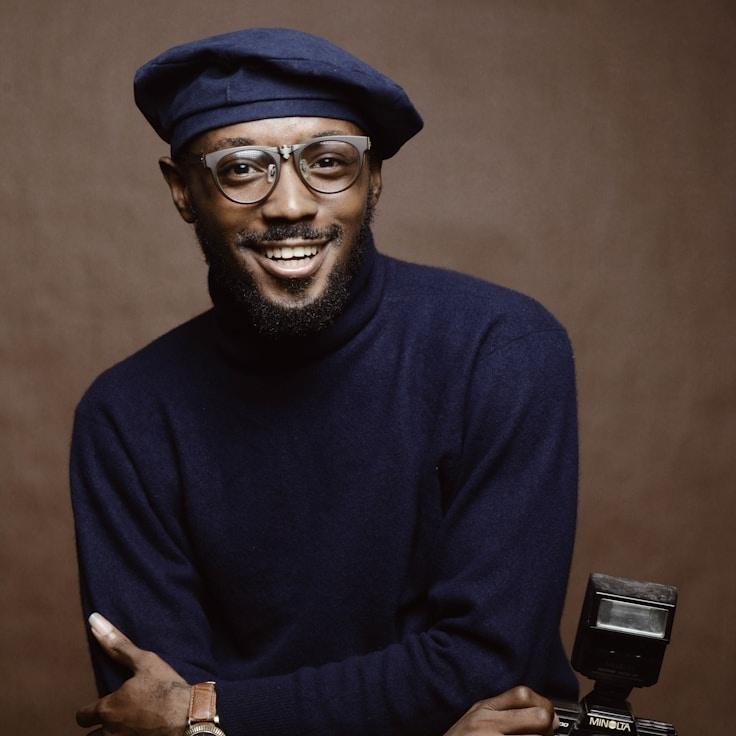 Aria Patel, Lead Design Curator at Nova Path Echo, reviewing corporate floral arrangements